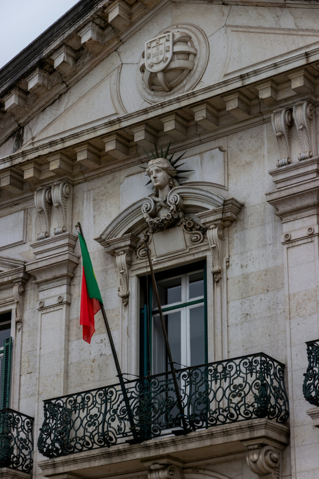 red and green flag on white concrete building